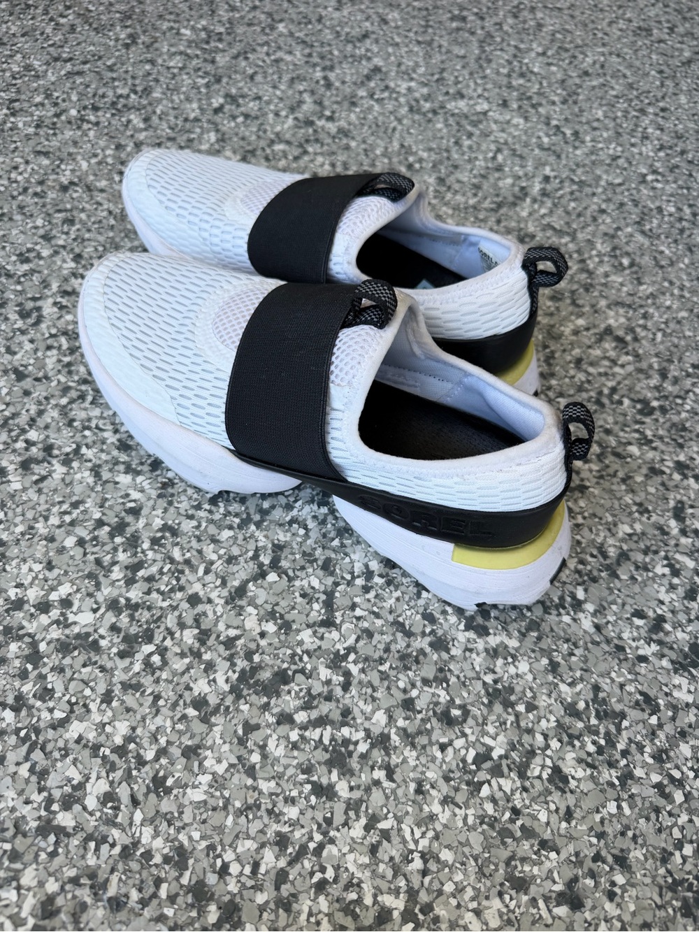 Sorel Kids White Slip-On Sneakers with Black Strap and Yellow Accent